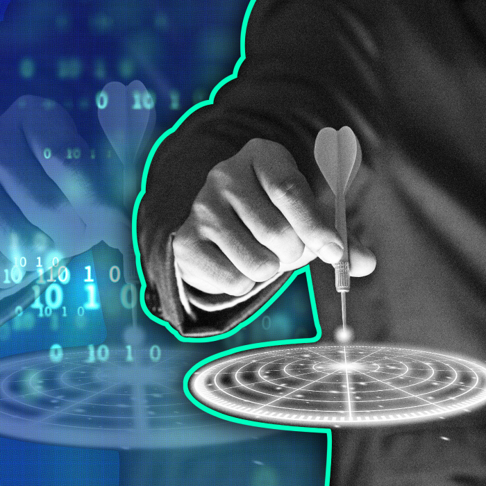 Hand holding a dart with a digital background