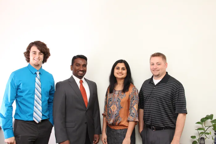 The four people Nishtech started with, in the first office.