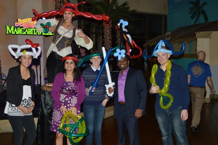 The Nishtech team in balloon hats at the 2013 holiday party.