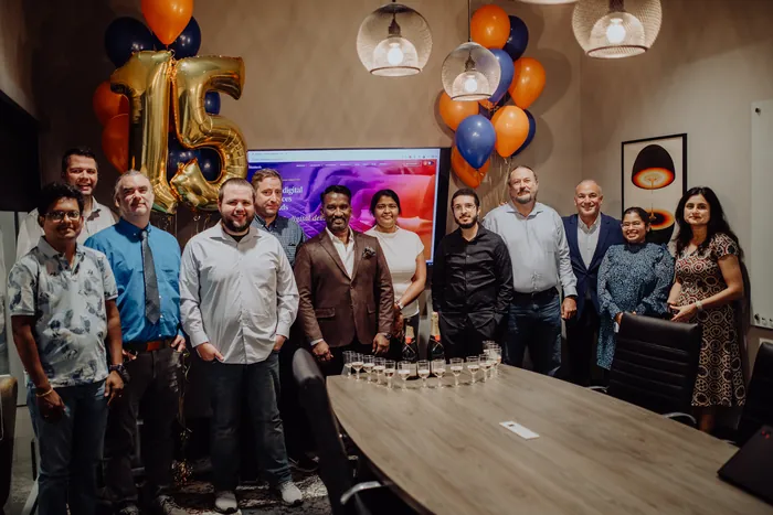 The Nishtech team at the fifteen-year celebration, with the new nishtech.com on the screen behind them.